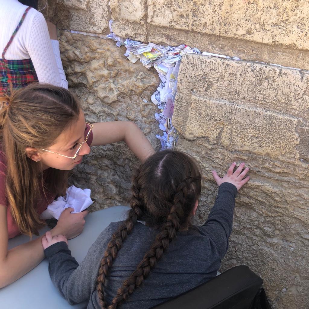 young-girl-putting-note-in-Kotel.jpeg